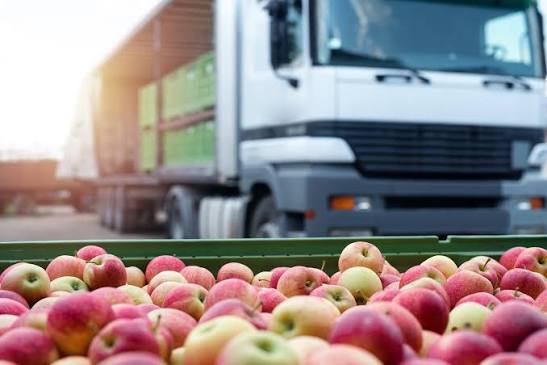 Delivery truck loaded with a crate of fresh apples at dispatch